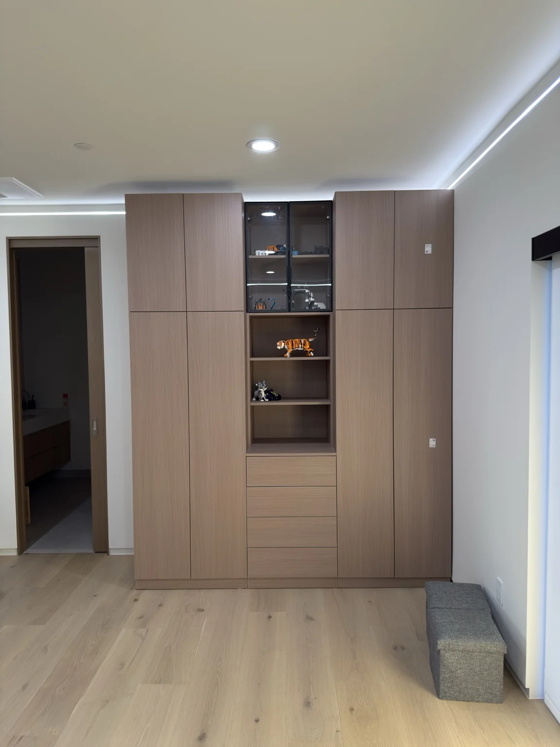 Built-in storage with tall doors, shelves and drawers