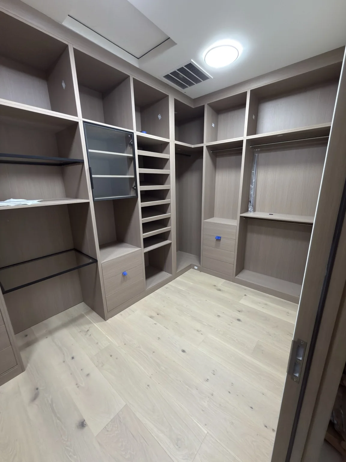 Open closet shelving, hanging compartments and drawers