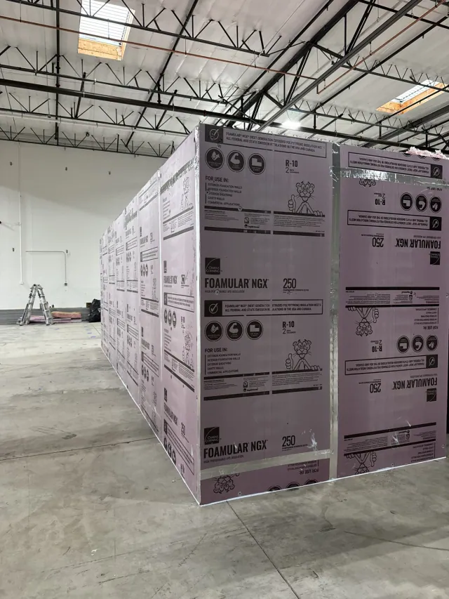 Rigid foam panels and corner detail around a commercial interior enclosure