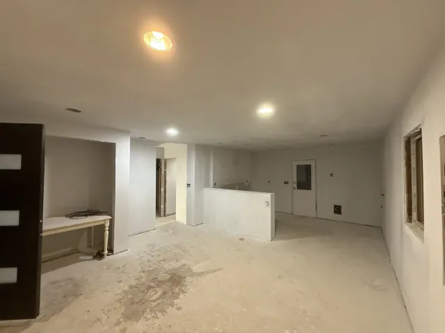 Interior walls and ceiling after surface finishing, before flooring and trim