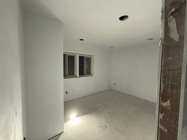 Finished wall surfaces around a window before trim installation