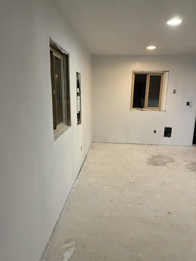 Interior wall finish around windows and service openings