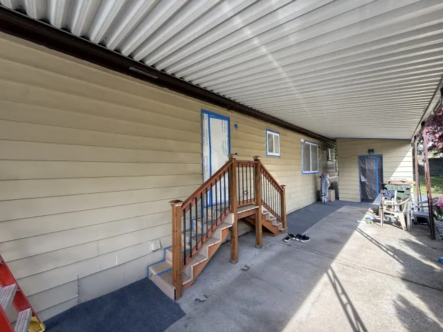 Windows and doors masked before exterior painting