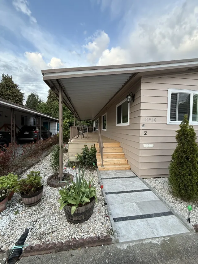 Completed exterior painting viewed from the front entry