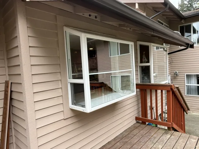 Replacement projecting kitchen window with white exterior trim