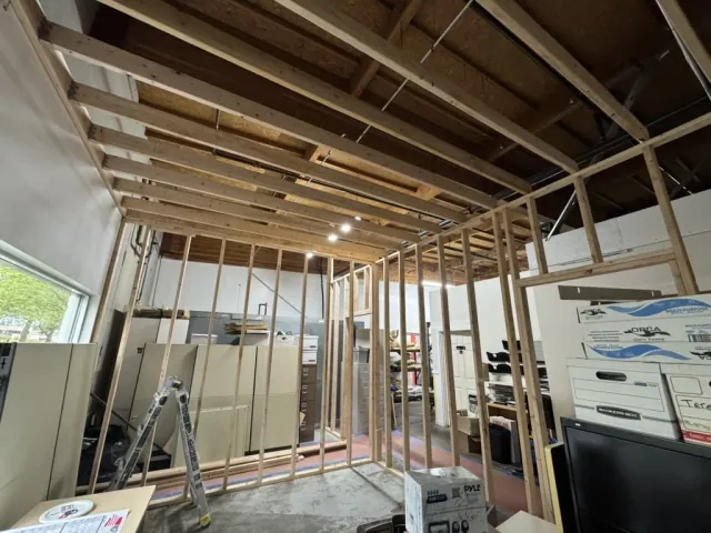 Wood wall framing and door openings in an existing interior
