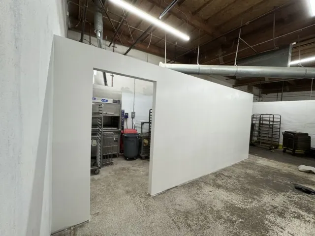 White interior partition with a finished rectangular opening