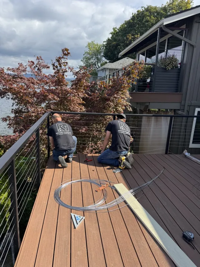 Remodel Tsaruk LLC crew installing cable railing on a residential deck